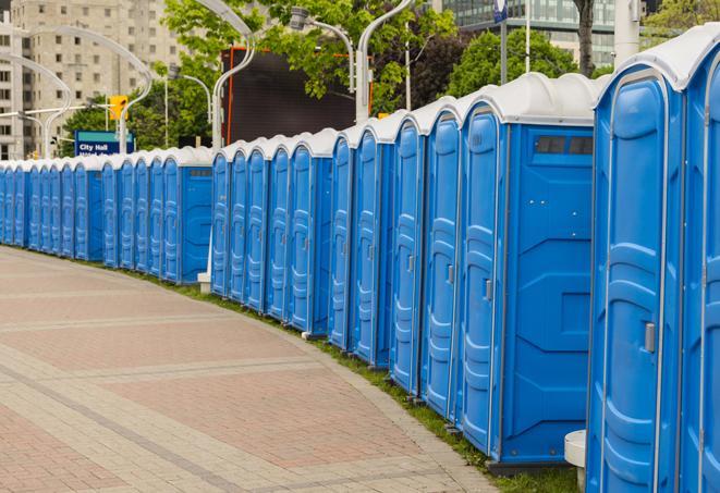 a row of portable restrooms ready for eventgoers in Menlo Park